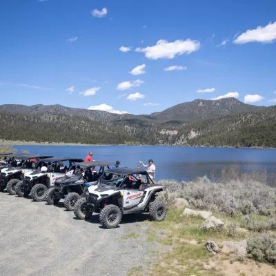 a group of parked motorcycles sitting on the side of a mountain