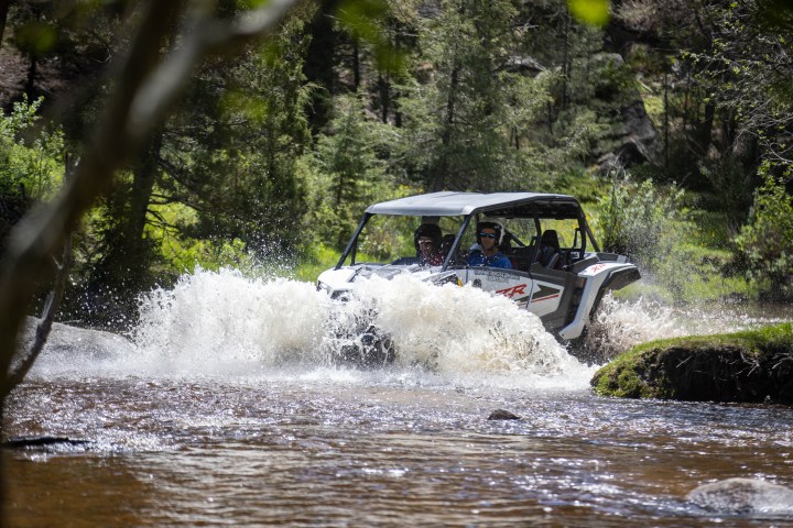 a man riding a wave on a surfboard in the water