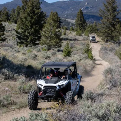 a truck traveling down a dirt road