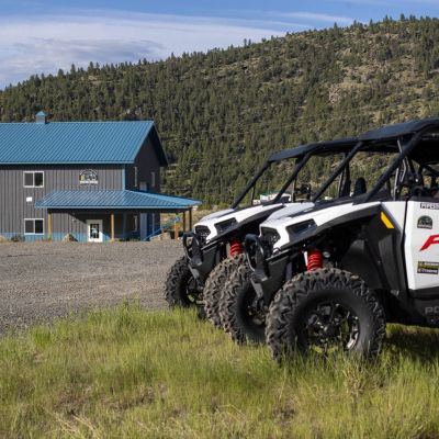 a truck is parked in a grassy field